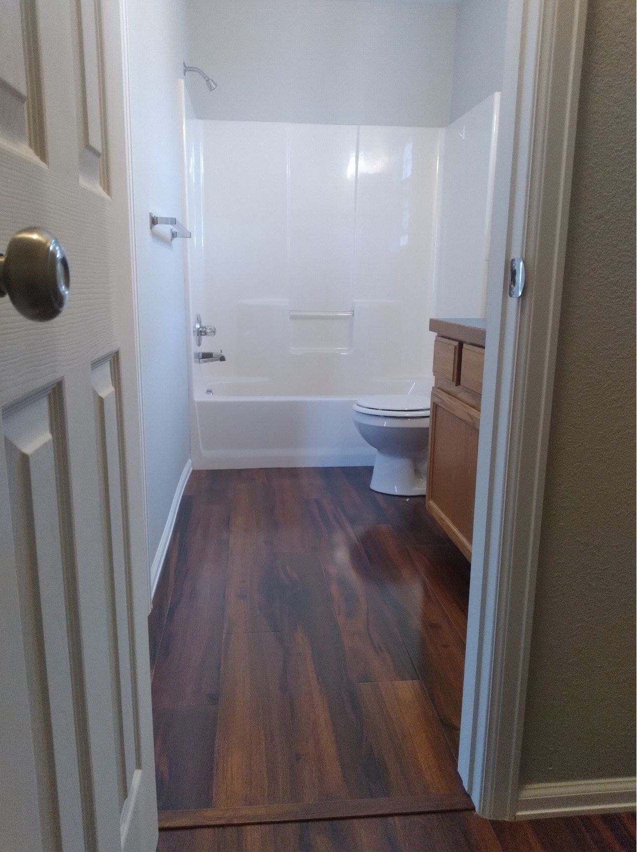 After Bathroom Remodel - Modern Design with New Flooring and Fresh Paint